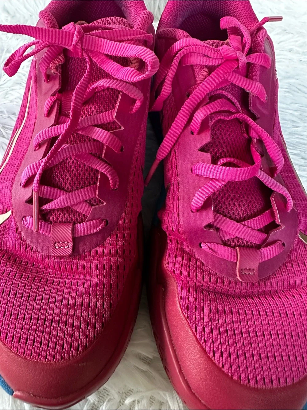 Nike Women's Bold Pink Athletic Court Shoes with Teal Purple Gradient Accent.